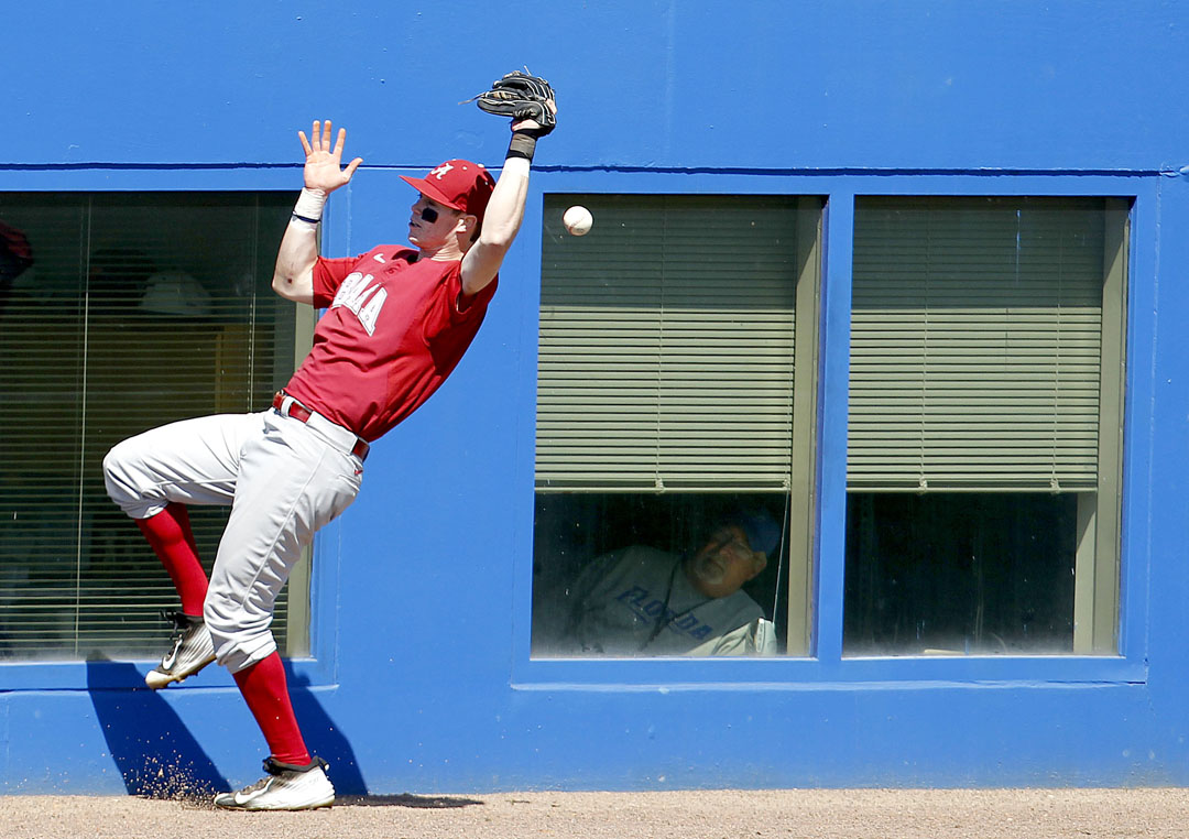 Alabama Crimson Tide infielder Chance Vincent drops the ball in foul territory against the Florida Gators on Saturday, March 28, 2015 in Gainesville, Fla. Florida defeated Alabama 7-4 to win the series. (Matt Stamey/Staff photographer)