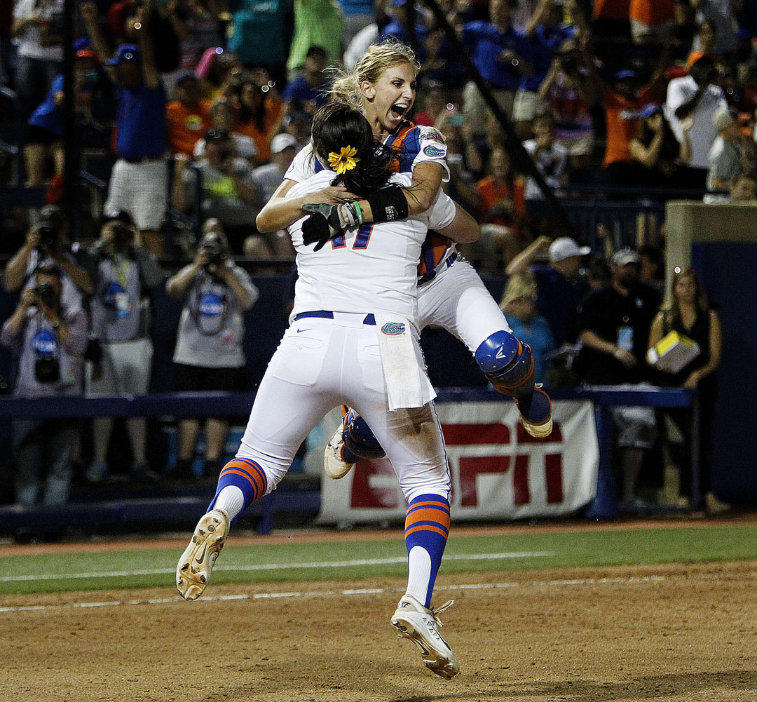 Florida Gators pitcher Lauren Haeger and catcher Aubree Munroe celebrate after defeating the Michigan Wolverines 4-1 to win the Women's College World Series on Wednesday, June 3, 2015 in Oklahoma City. (Matt Stamey/Staff photographer)