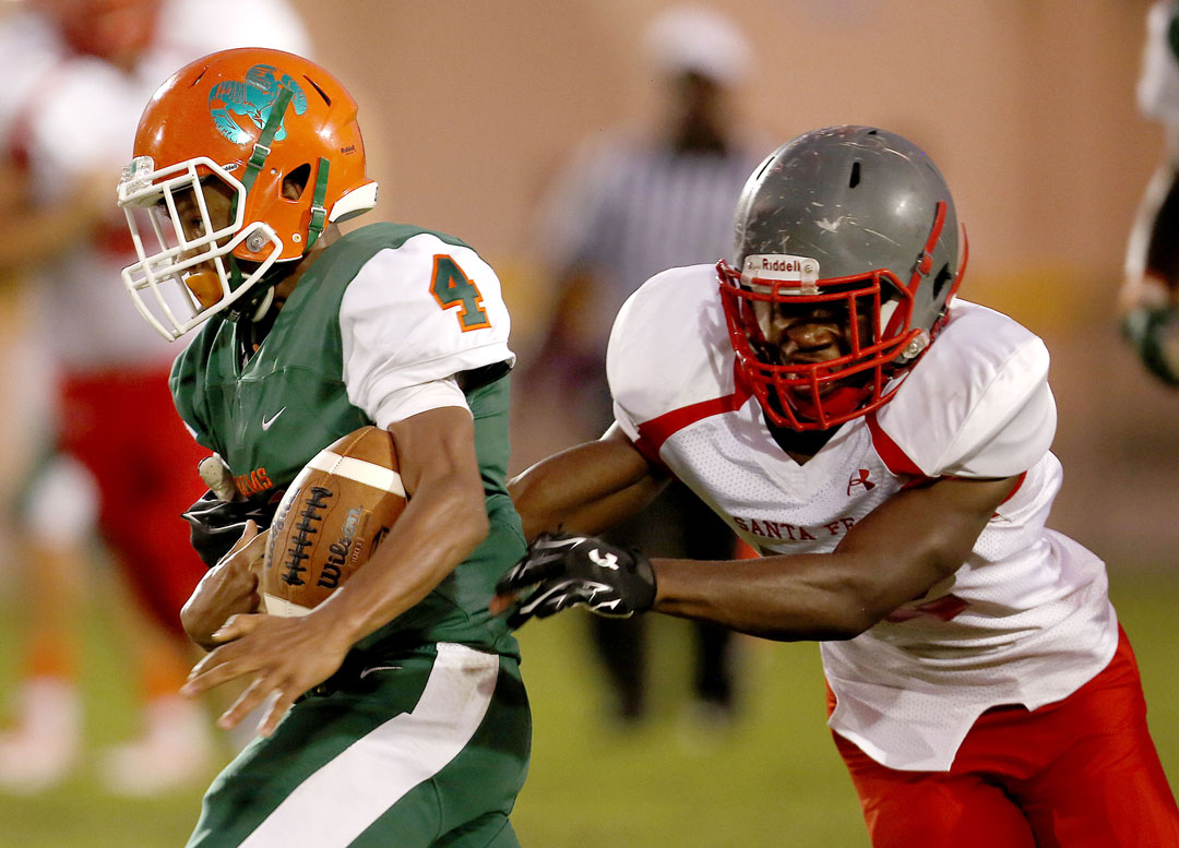 Eastside Rams wide receiver Devonte Tanksley has the ball knocked away by a Santa Fe Raiders defender on Friday, Sept. 9, 2016 in Gainesville, FL. The Raiders recovered the fumble. Santa Fe defeated Eastside 24-20. Matt Stamey/Gainesville Sun