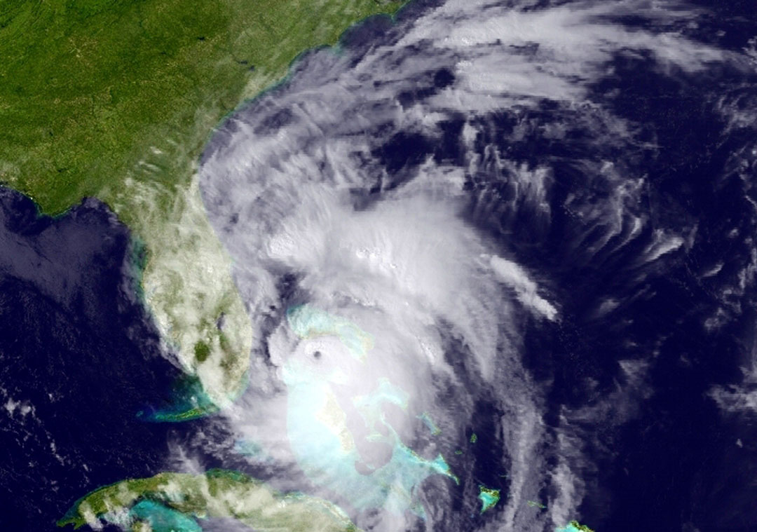 This GOES East satellite image posted at 5:12 p.m. and provided by the National Oceanic and Atmospheric Administration (NOAA), shows Hurricane Matthew moving northwest along the east coast of Florida, Thursday, Oct. 6, 2016. Leaving more than 100 dead in its wake across the Caribbean, Hurricane Matthew steamed toward heavily populated Florida with terrifying winds of 140 mph Thursday, and 2 million people across the Southeast were warned to flee inland. (NOAA via AP)