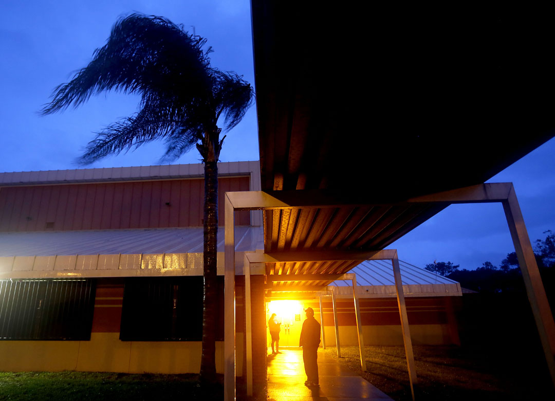 Evacuees step outside to watch the wind and rain while at the shelter at Mason Elementary during Hurricane Matthew on Friday Oct. 7, 2016 in St. Augustine, FL. Matt Stamey/Gainesville Sun