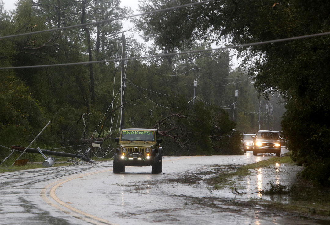 Traffic navigates around down power lines during Hurricane Matthew on Thursday, Oct. 6, 2016 in St. Augustine, FL. Matt Stamey/Gainesville Sun