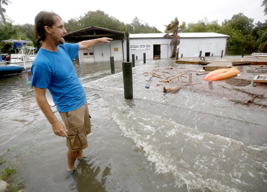 Adam Murley points out flooding and damage at a fishing camp along the intracoastal at Crescent Beach during Hurricane Matthew on Thursday, Oct. 6, 2016 in St. Augustine, FL. Matt Stamey/Gainesville Sun