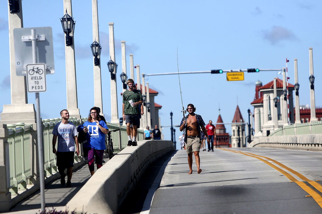 Pedestrians walk across the Bridge of Lions after Hurricane Matthew on Friday, Oct. 8, 2016 in St. Augustine, FL. Vehicles were not allowed and only residents could walk across. Matt Stamey/Gainesville Sun