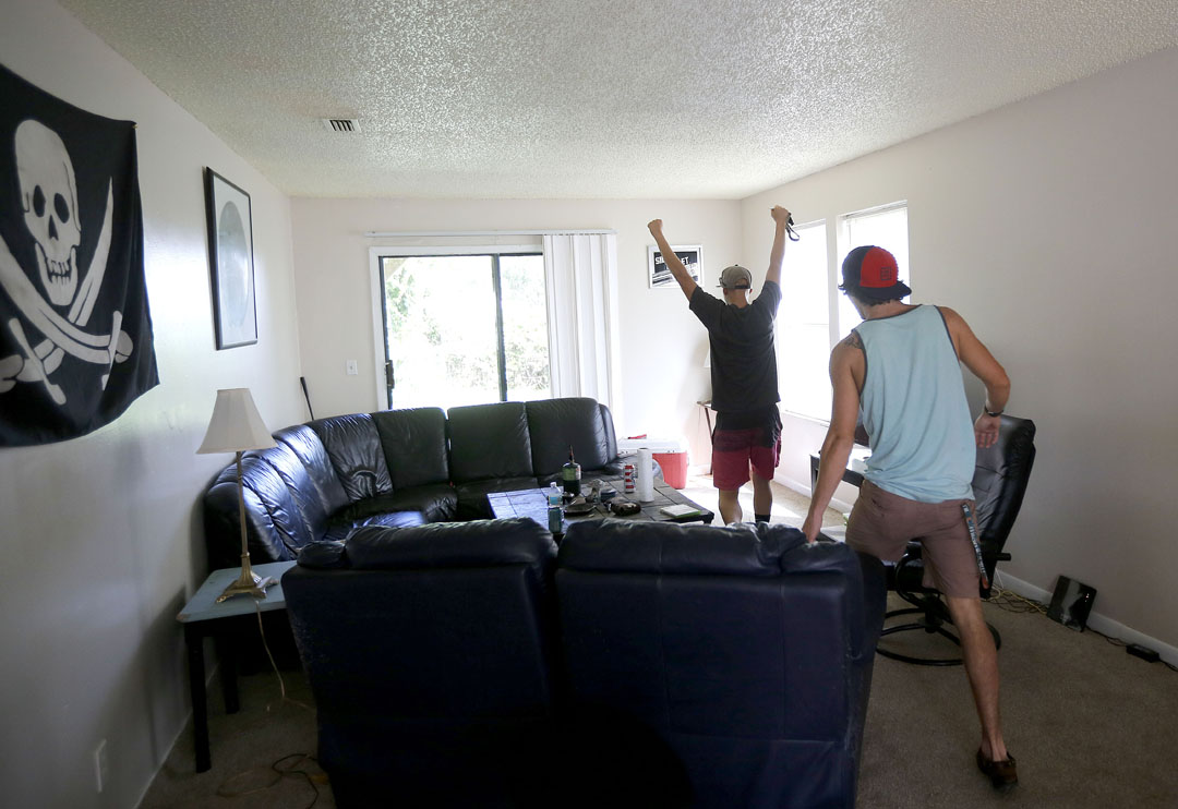 Chase Perkins throws his fists in the air with excitement after seeing that his house on the island didn't take on any water from Hurricane Matthew on Friday, Oct. 8, 2016 in St. Augustine, FL. Matt Stamey/Gainesville Sun