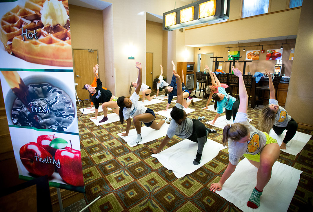 The Santa Fe Saints do a yoga workout in the lobby of their hotel before their final four match at the NJCAA National Tournament on Friday, Nov. 18, 2016 in in Casper, WY. (Photo by Matt Stamey/Santa Fe College)