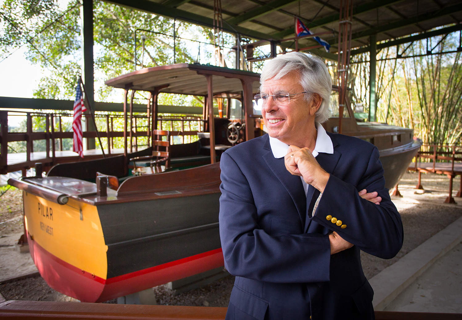 Dr. Jackson Sasser listens to Hemingway Museum Director Ada Rosa Rosales talk about the Pilar at the Finca Vigia on Monday, Jan. 30, 2017 in San Francisco de Paula, Cuba. Ernest Hemingway lived in the Finca Vigia from 1939 to 1960. The Pilar is a 38-foot fishing boat used by Hemingway. (Photo by Matt Stamey/Santa Fe College)