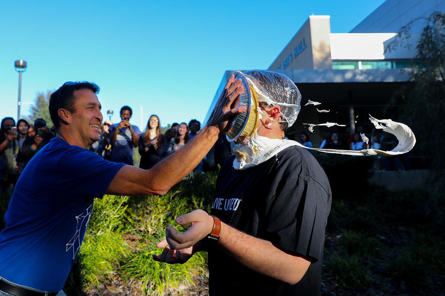 After losing the penny wars, Santa Fe College Student Body President Cale McCall received a pie in the on Friday, Nov. 17, 2017 in Gainesville, Fla. The SF faculty and staff defeated the students in the Penny Wars 2017 competition, awarding Vice President of Student Affairs Dr. Naima Brown the right to hit McCall with a pie. Dr. Brown decided not to hit McCall with the pie, instead giving the honor to Doug Bagby Associate Director of Student Life. Penny wars is a fundraising effort at Santa Fe College for the United Way of North Central Florida. (Photo by Matt Stamey/Santa Fe College) ***SUbjects have Releases***