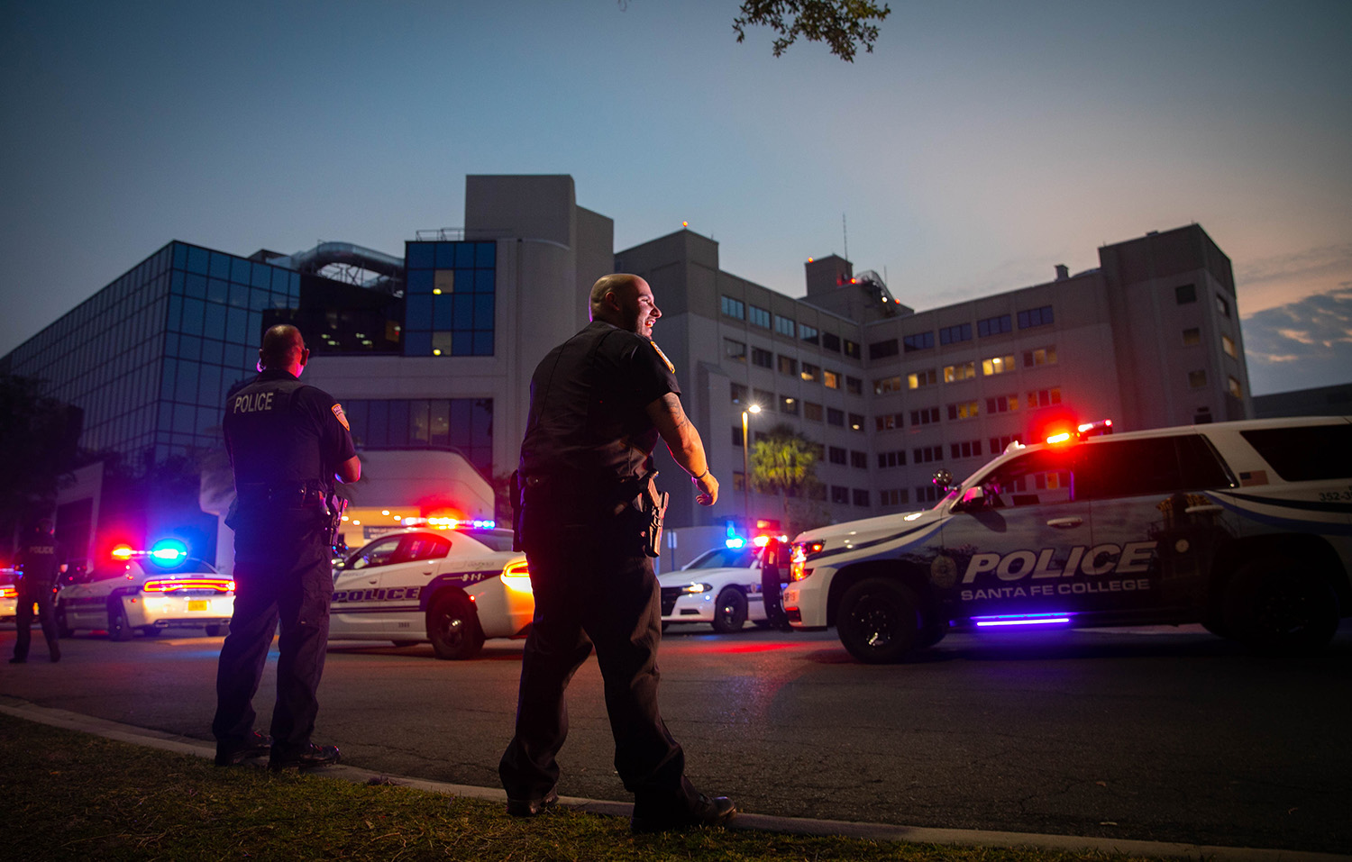 Santa Fe College police department officers took part in an event to show support for health care workers at North Florida Regional Medical Center on April 12, 2020 in Keystone Heights, Fla. Local law enforcement drove around the hospital with lights and sirens. They parked and got outside and clapped toward the windows. Many workers from the hospital came outside to show their support for the law enforcement officers.  (Matt Stamey/Santa Fe College ) ***ONLY SFPD OFFICERS HAVE RELEASES***