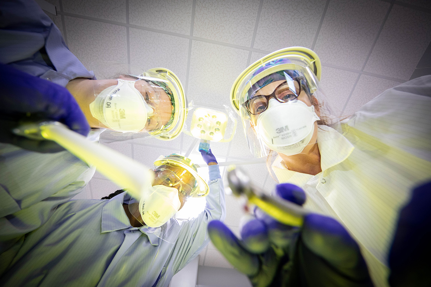 Santa Fe College dental students and faculty pose for a photo to look like they’re working on a patient from the patient’s point of view on Nov. 3, 2020. (Matt Stamey/Santa Fe College ) ***Subjects Have Releases***