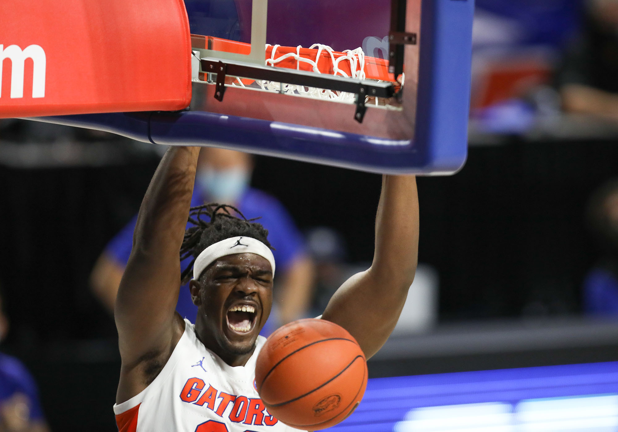 Florida Gators center Jason Jitoboh (33) yells after a dunk against the Tennessee Volunteers during the second half of an NCAA college basketball game Tuesday, Jan. 19. 2021, in Gainesville, Fla. Florida defeated no. 6 Tennessee 75-49. (AP Photo/Matt Stamey)