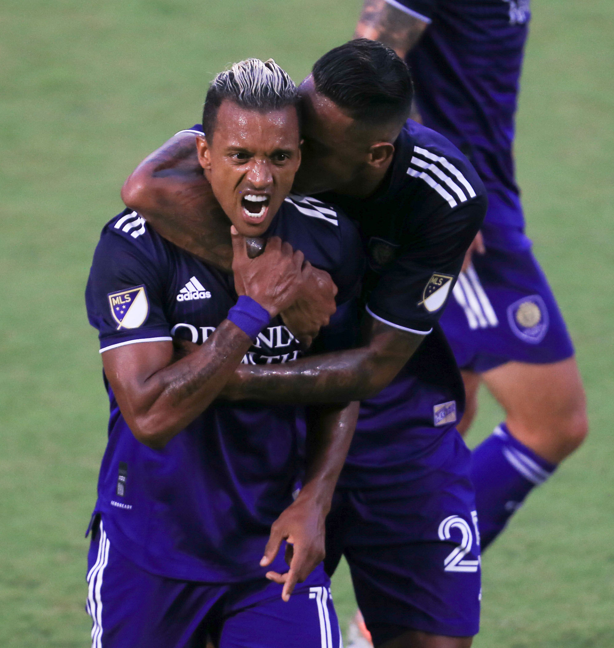 May 1, 2021; Orlando, Florida, USA; Orlando City forward Nani (17) celebrates with defender Antonio Carlos (25) after scoring a goal against FC Cincinnati at Orlando City Stadium. Mandatory Credit: Matt Stamey-USA TODAY Sports